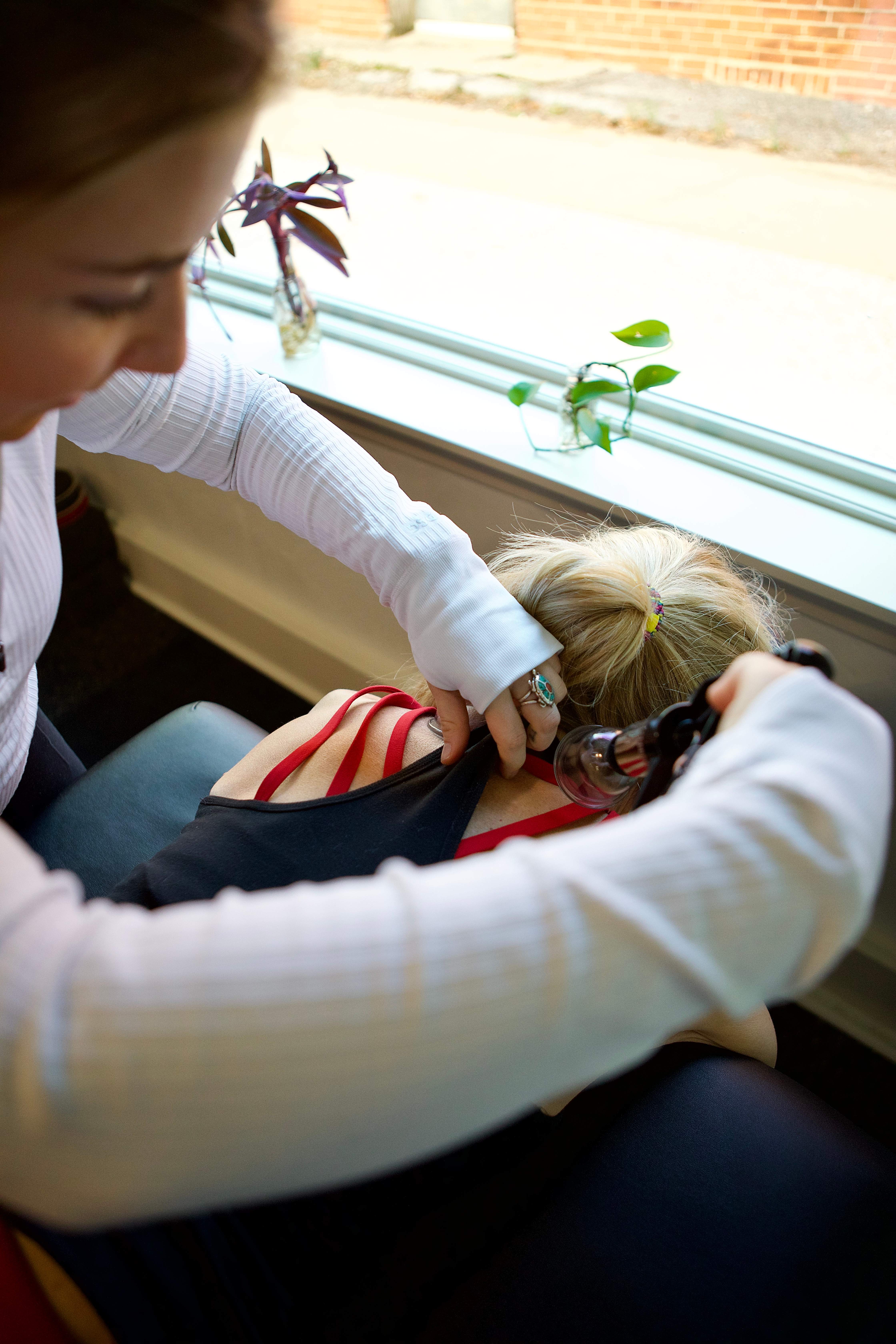 Hannah providing personalized attention and recovery work with a client